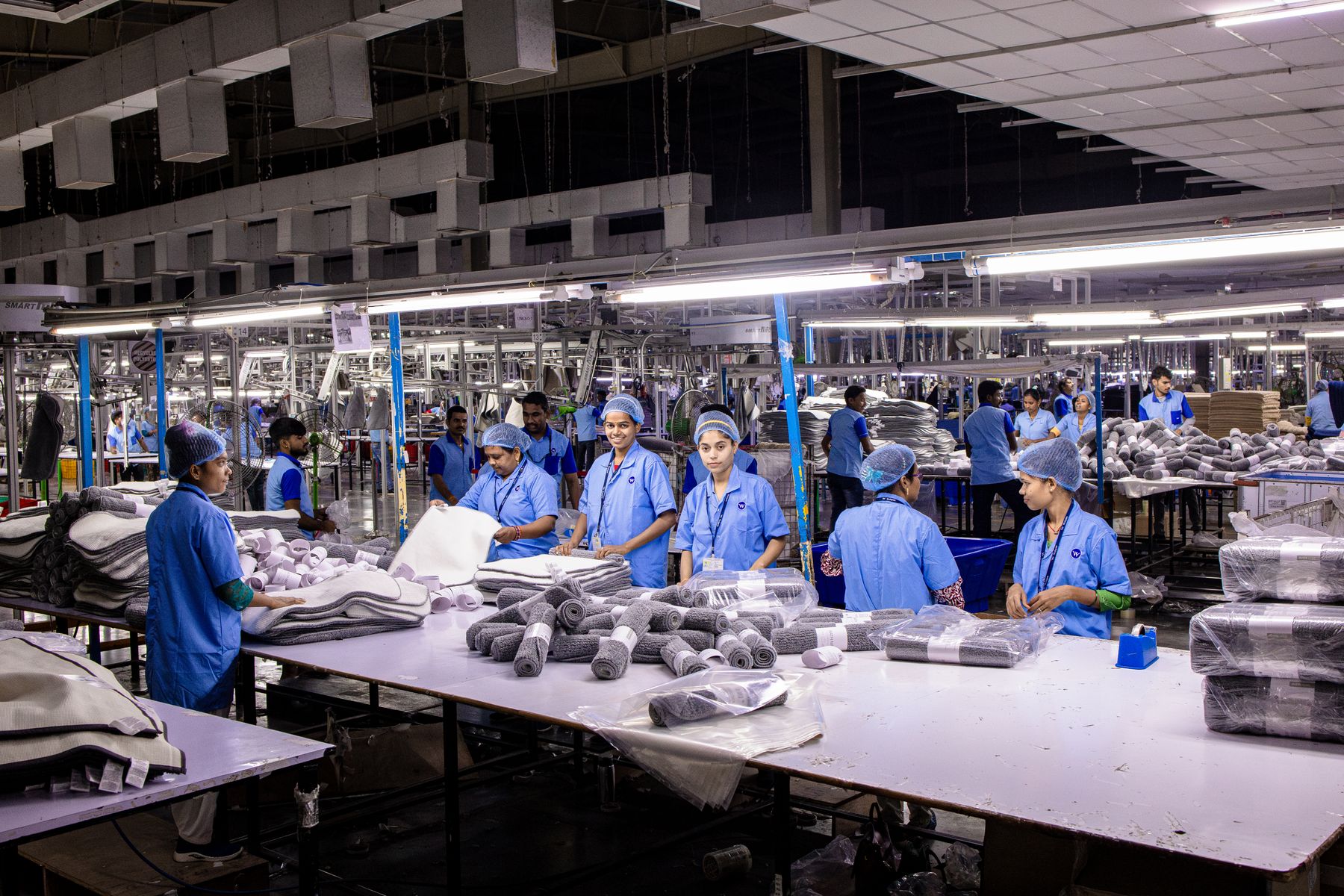 A production team working across an organised packing floor